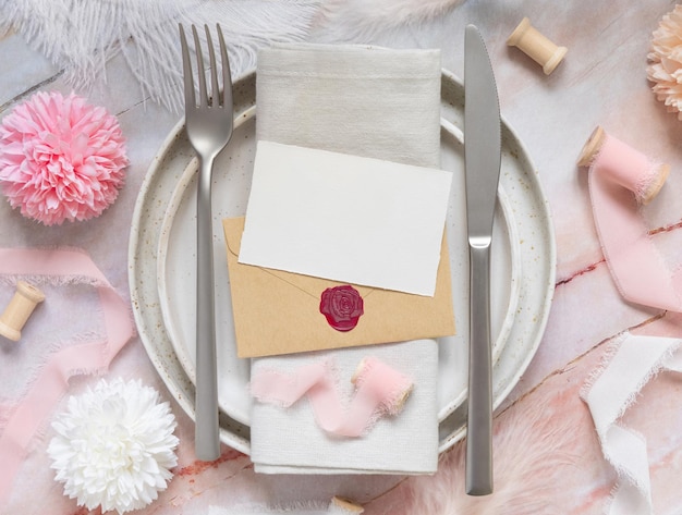 premium-photo-wedding-table-place-with-a-paper-card-over-envelope