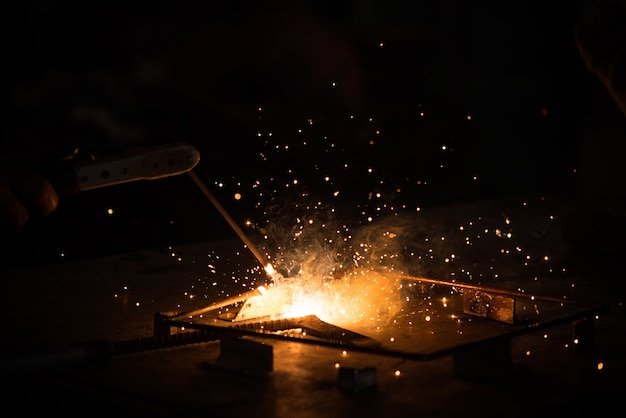 Premium Photo | Welding, metal working on dark background