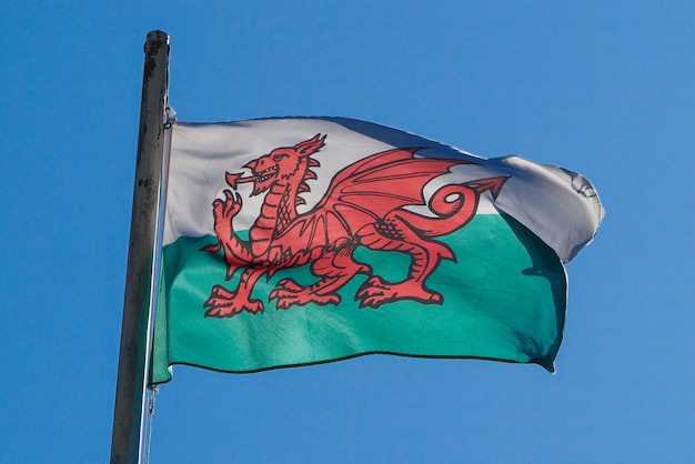 Premium Photo | Welsh flag of wales over blue sky