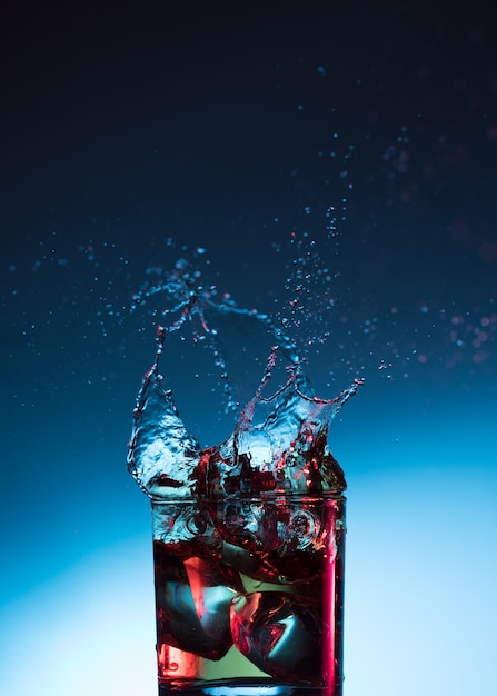 Premium Photo | Whisky cocktail liquor splash alcohol in glass