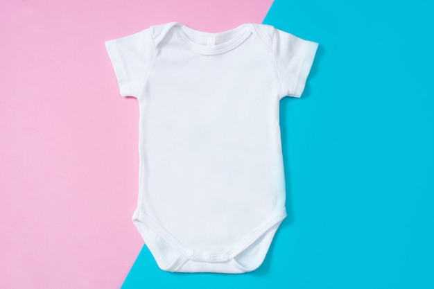 Premium Photo | White baby romper on a multicolored background