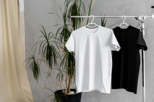 Premium Photo | White and black tshirts on hangers for design presentation
