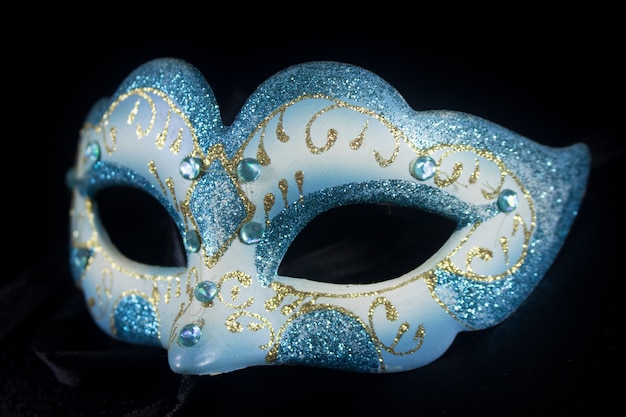 Premium Photo | White blue glitter masquerade mask party isolated black