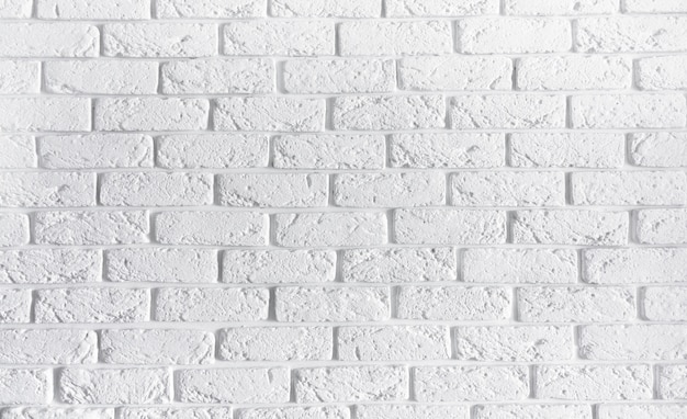 白いレンガの壁のホームインテリアの背景 空白のテクスチャコンクリートセメントパターン表面石積みレンガ 造りの抽象的なテクスチャライトエイジペイント汚れたさびたブロックコピースペースと石造りの プレミアム写真