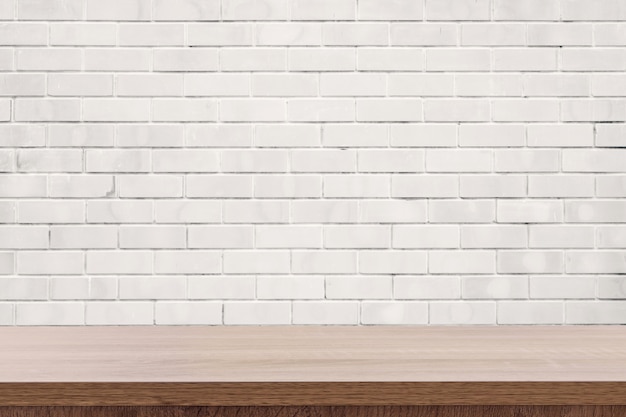 Premium Photo | White brick wall and wooden table