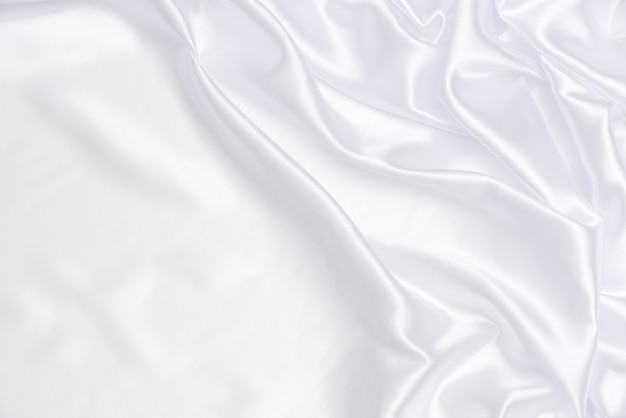 White and bright fabric background and texture, crumpled of white satin for abstract and design Premium Photo