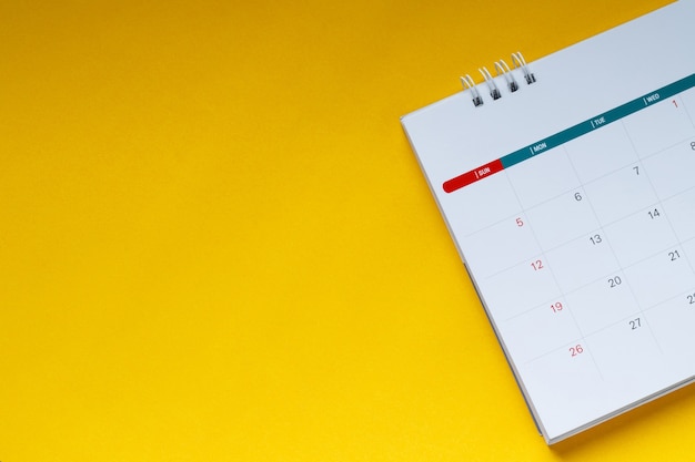 Premium Photo | White clean calendar on yellow background with copy space