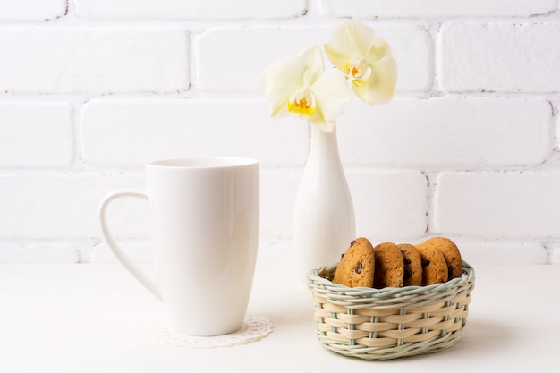 Download White coffee cappuccino mug mockup with soft yellow orchid ...