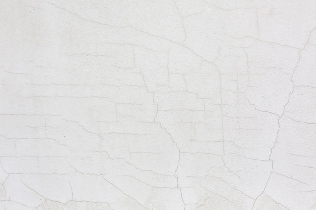 白いひびの入った壁漆喰テクスチャ背景 無料の写真