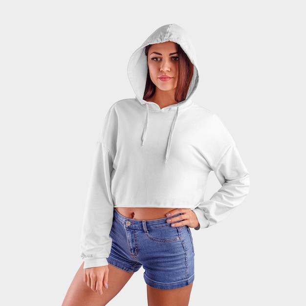 Premium Photo | White crop top hoodie on a young beautiful girl in blue ...
