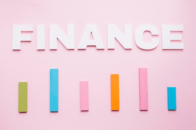 Free Photo | White finance text over the colored bar graph on pink  background