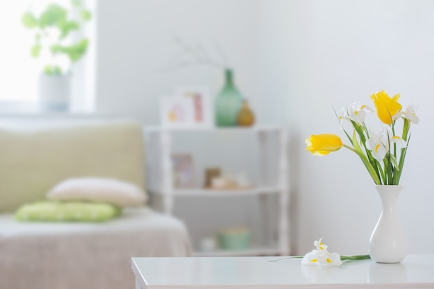 Premium Photo White Home Interior With Spring Flowers And Decorations