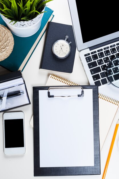 White Office Desk Table With A Lot Of Things On It Premium Photo