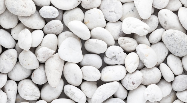 Premium Photo | White pebbles stone texture and background