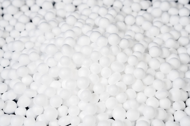 Premium Photo | White polystyrene foam beads ball drop from styrofoam ...