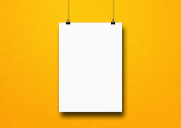 Download Premium Photo White Poster Hanging On A Yellow Wall With Clips Blank Mockup Template Yellowimages Mockups