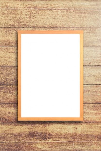 White poster with wood frame mockup on wooden wall ...