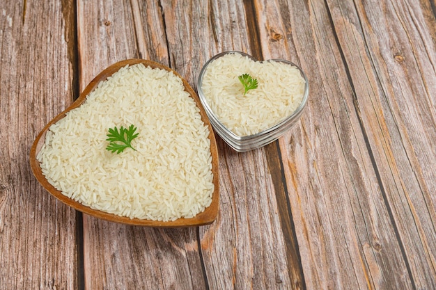 Free Photo White Rice Is Placed In A Cup On The Wooden Floor