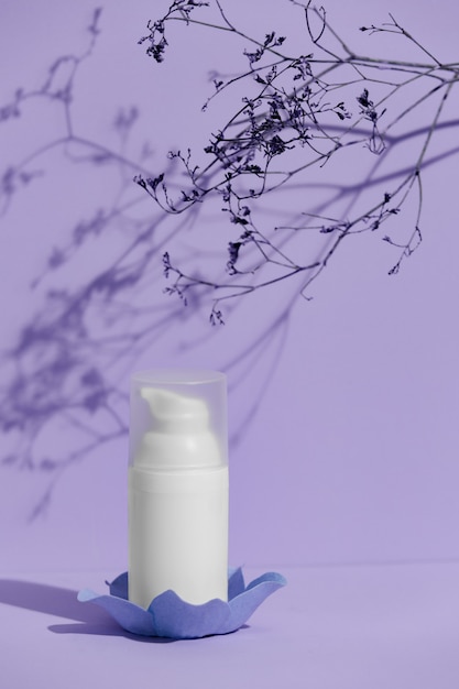 White skincare product tube on a purple background advertisement concept Premium Photo