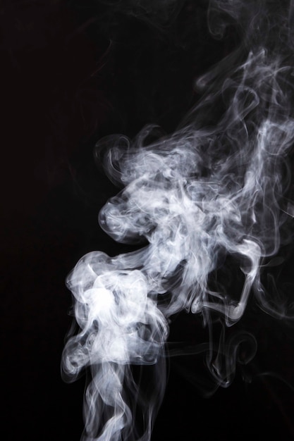 White smoke spread on black background | Free Photo