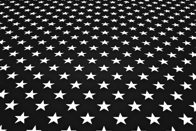 Premium Photo | White stars on black fabric