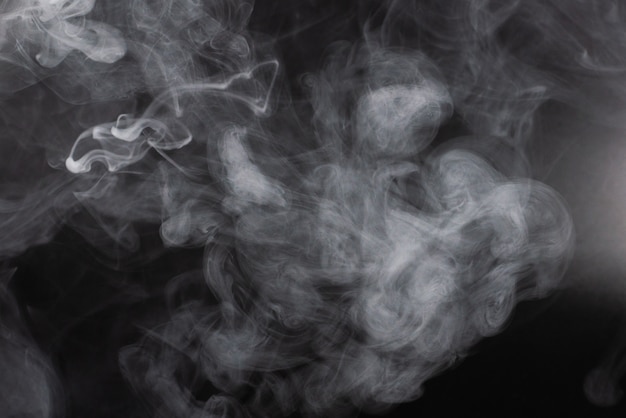 Premium Photo | White steam black background.