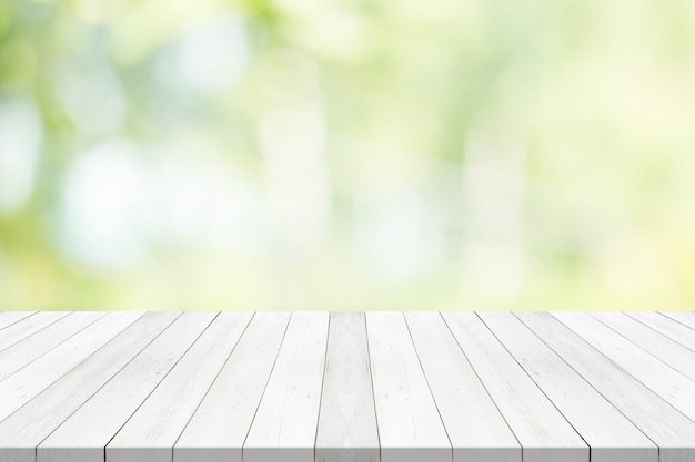 White table top on green blurred background Photo | Premium Download