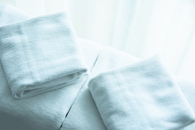 White towel on white mattress fabric, soft light in the morning. Premium Photo
