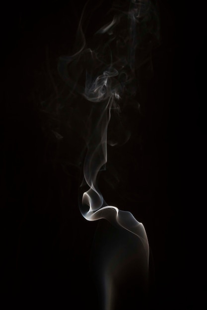 Free Photo | White wispy smoke swirls on black background