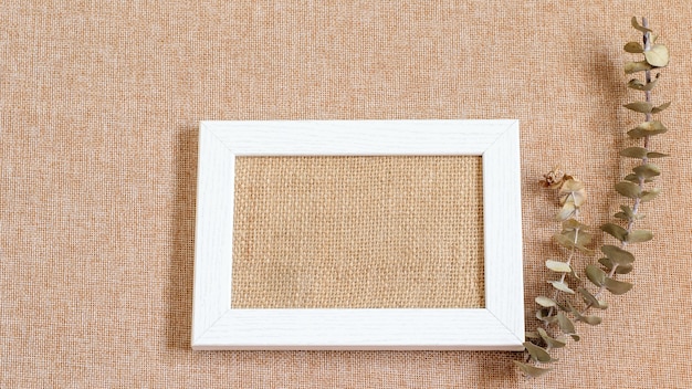 Download Premium Photo White Wooden Picture Frame With Burlap Clothes In The Center And Eucalyptus Branch For Decoration Grunge Burlap Textured Background