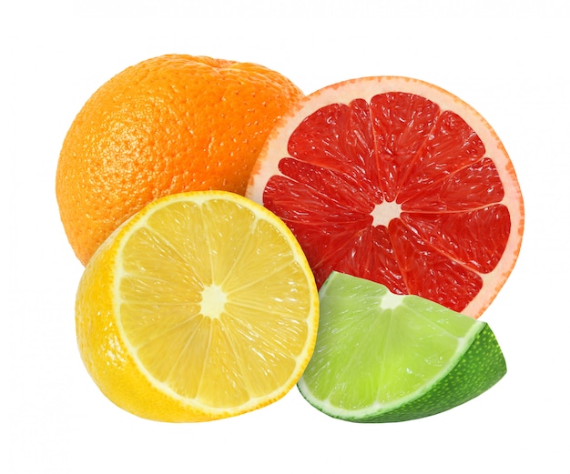 Premium Photo | Whole and cut orange, grapefruit, lemon, lime fruits ...