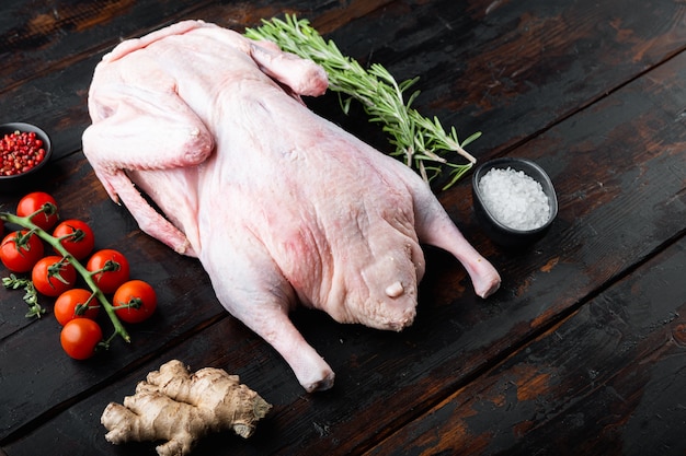 Premium Photo | Whole raw goose meat on dark wooden