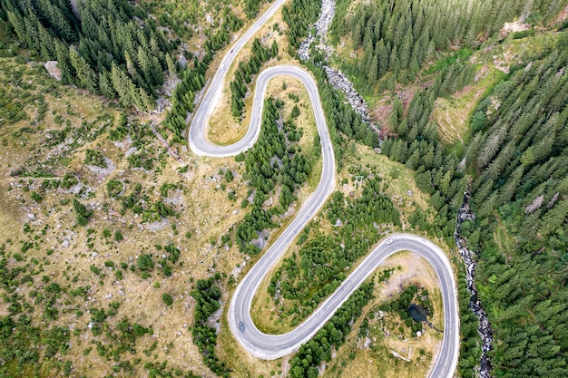 Premium Photo | Winding road in the mountains, aerial view.