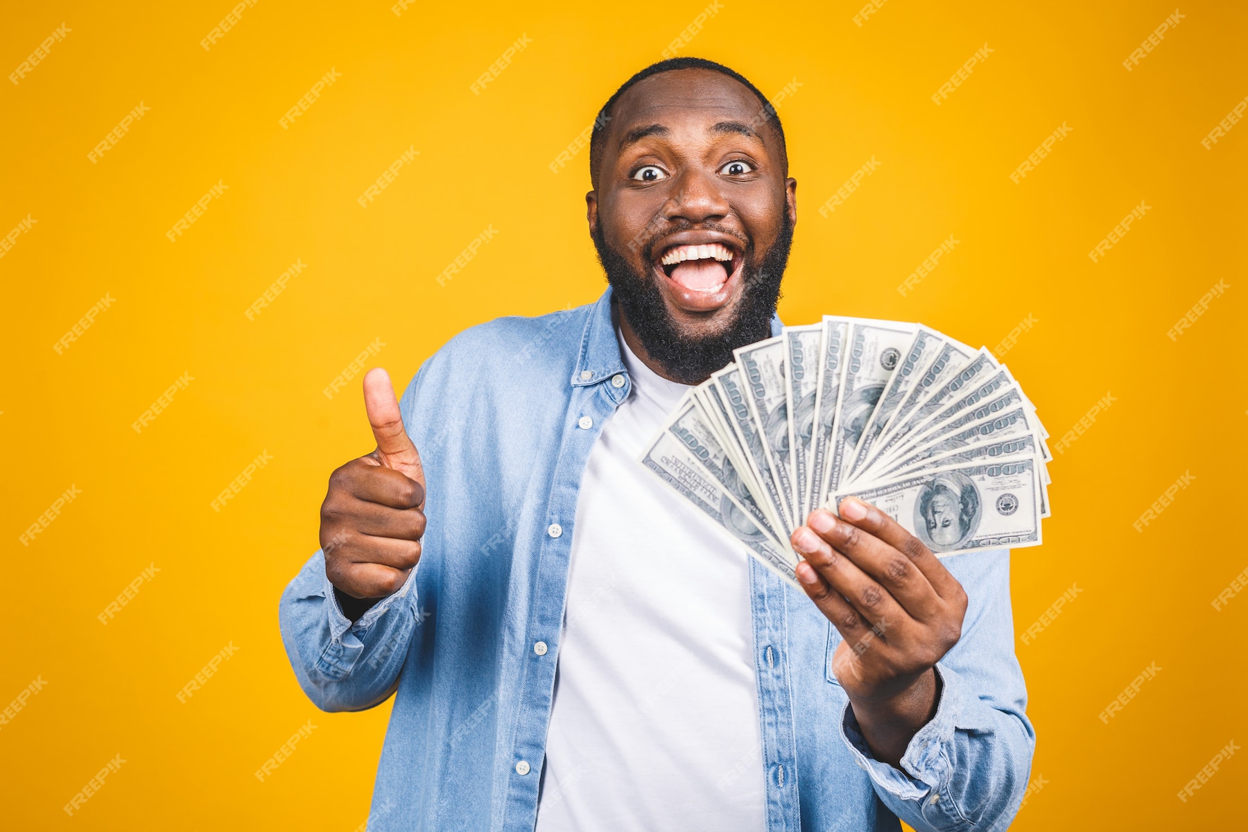 Premium Photo | Winner! young rich african american man in casual t ...