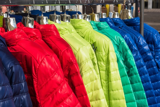 Premium Photo | Winter clothes hanging at a store