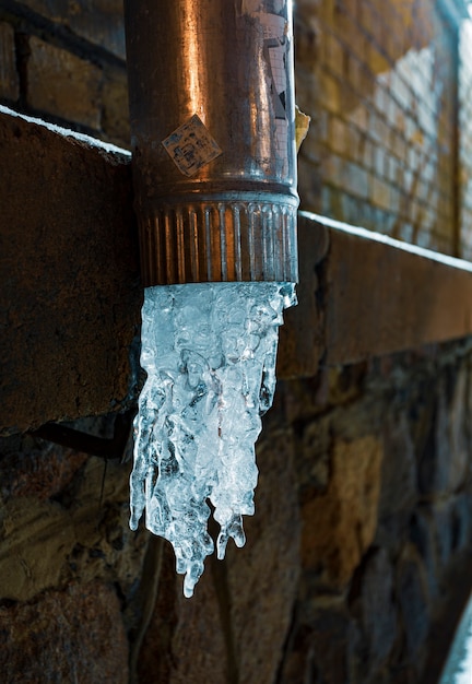 Premium Photo In Winter Water Froze In Drainpipe