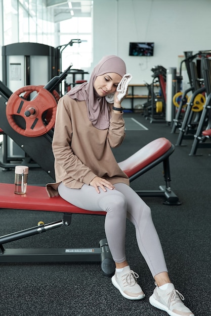 Premium Photo | Wiping sweat away in gym