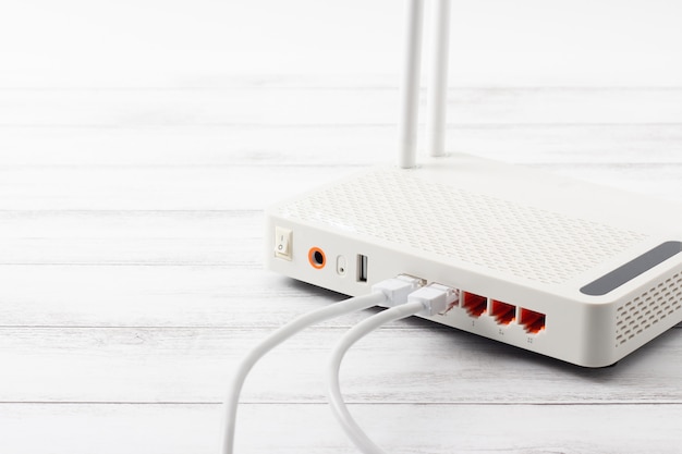 Wireless modem router network hub on wooden table Premium Photo