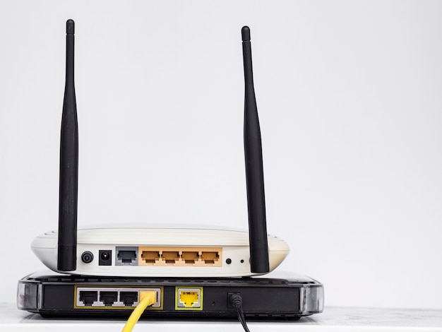 Wireless routers stacked on one another Free Photo
