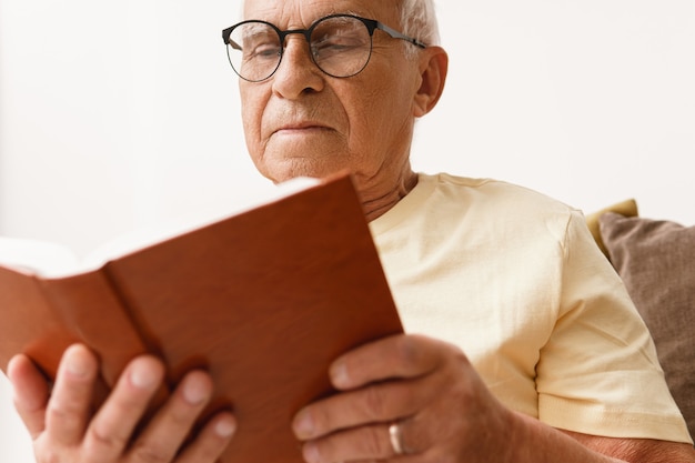 Premium Photo Wise Elderly Man Is Reading Book