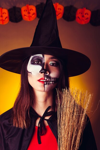 Free Photo | Witch holding broom