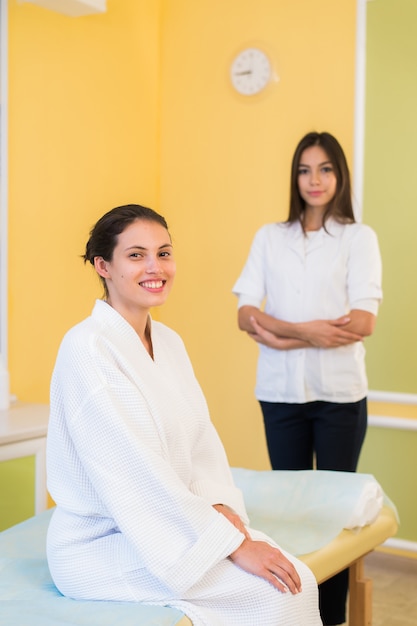 Premium Photo Woman Beautician Doctor With Patient In Spa Wellness Center