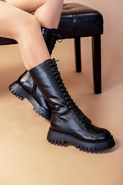 Premium Photo | Woman in black leather boots from the new collection ...