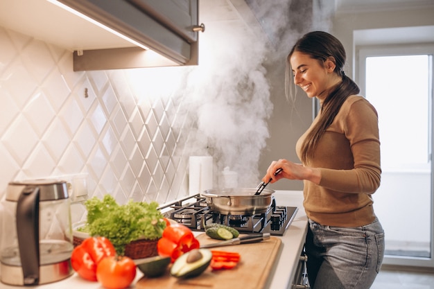 Woman cooking at kitchen Free Photo