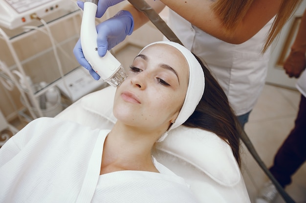 Woman in cosmetology studio on laser hair removal Free Photo