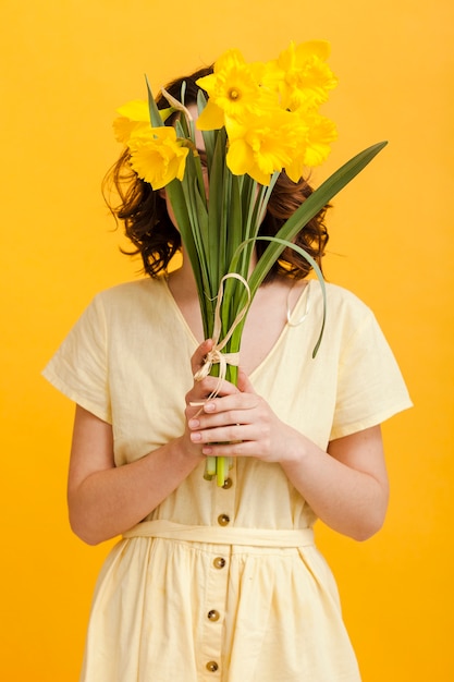 Free Photo | Woman cover face with flowers