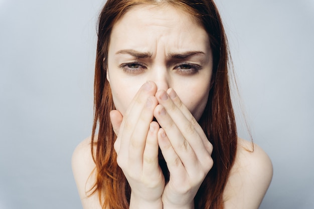 Premium Photo | Woman covering her mouth, sneezing expression