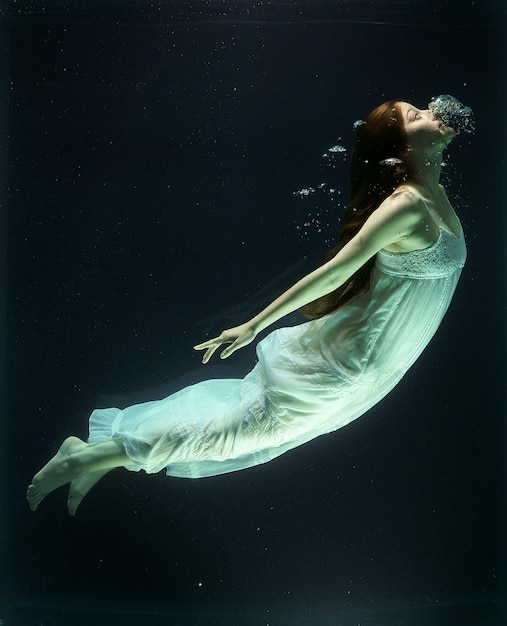 Woman diving into the water tank Photo | Free Download