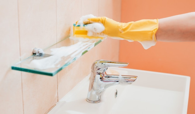 Premium Photo | Woman doing chores in bathroom at home