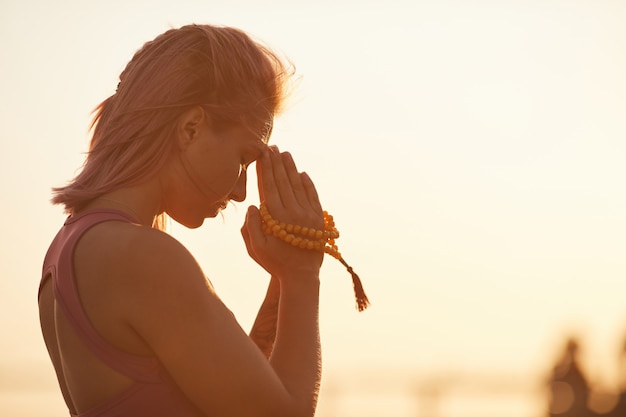 Premium Photo Woman Doing Yoga During Sunset